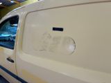 a white van with a sticker on the side of it