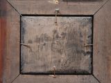 a picture of a wooden picture frame with nails on it