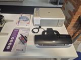 an image of a printer and other electronics on a table
