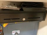 an image of a cash machine with a drawer on top of it