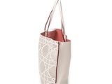 the white and red tote bag is on display against a white background