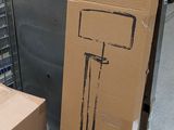 a cardboard box that has a lamp on it