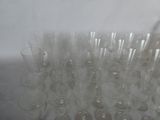 a lot of empty wine glasses sitting on a table