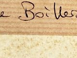 someone is writing on a piece of wood with a pair of scissors
