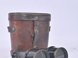 two binoculars sitting next to each other on a white surface