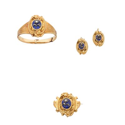 three gold rings and a ring with a lapis stone in the center