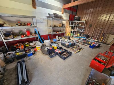 a room with a lot of tools and tools on the floor