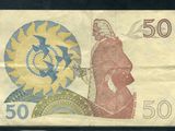 un vieux billet de banque sur lequel figure le portrait d'un homme