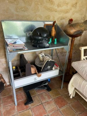 a small table with various items on it in a room