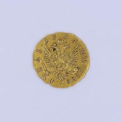 l'image d'une pièce d'or ornée d'une couronne