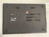a black laptop with a red sticker on the back of it