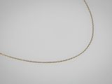 un collier à chaîne en or sur fond blanc