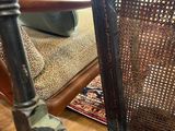 a chair that is sitting in a room with wood floors