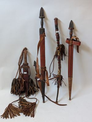several different types of weapons are displayed on a white surface