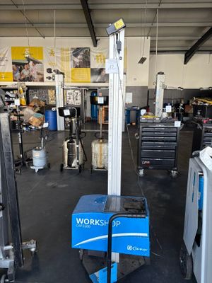 an image of a workshop area with a work bench and equipment