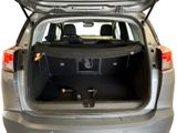the back of a car with the trunk open and the back seats down