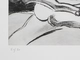 a black and white drawing of a woman laying on a bed