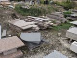 a pile of granite blocks sitting on the ground