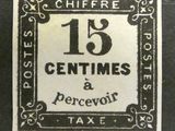 une photo d'un timbre sur lequel figurent la mention « 13 centimes » et « percevoir »