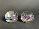 two clear glass bowls with colorful confetti on them