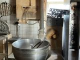 a large metal bowl sitting in the middle of a kitchen