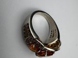 a close up of a ring on a table with a white background