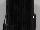 the back of a black suitcase sitting on top of a white table