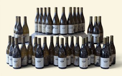 many bottles of wine that are stacked on top of each other