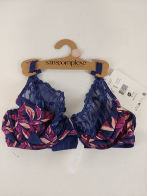 a close up of a bra top on a hanger on a wall