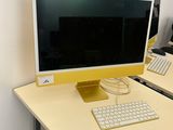a desk with a computer and a keyboard on it