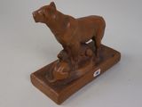 a statue of a dog and a cat on a table