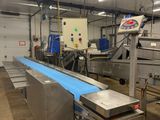 a conveyor belt in the middle of a factory