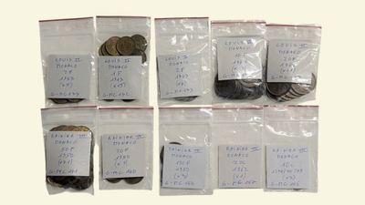 six bags of coins in each of them with a price tag