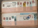an old book with stamps on it sitting on top of a wooden table