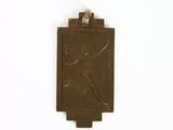 a picture of a bronze plaque of a woman holding a tennis racquet