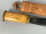 two different types of knives on a table