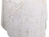 white lace shawl hanging on a clothes line against a white background