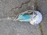 a blue machine that is laying on the ground