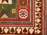a close up of a rug with many different designs on it