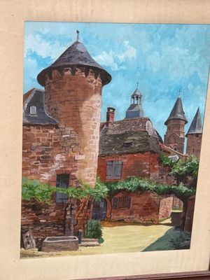 une photo d'un tableau représentant un château, dans un cadre