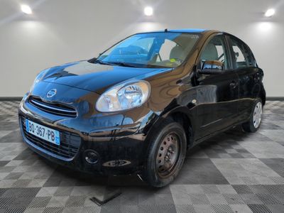 a picture of a small black car parked in a garage