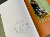 a book with a drawing of a man sitting on a chair