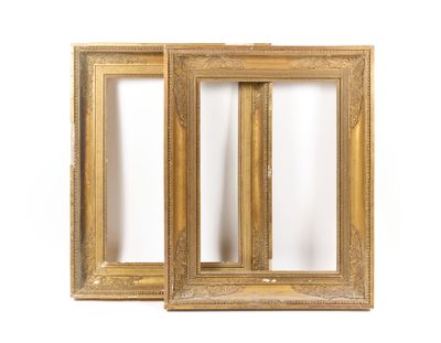 a pair of antique gold picture frames on a white background