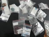 a lot of small bags of different kinds of buttons