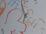 a drawing of a man playing a guitar on a sheet of paper