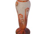 a glass vase that has a design on it