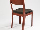 wooden chair with black leather seat against a white background