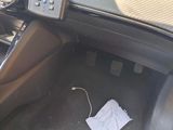 a remote control in the center of a car ' s dashboard