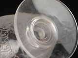 a clear cup with a plastic lid on top of it