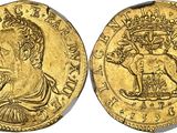 a gold coin with an image of a woman and a lion on it